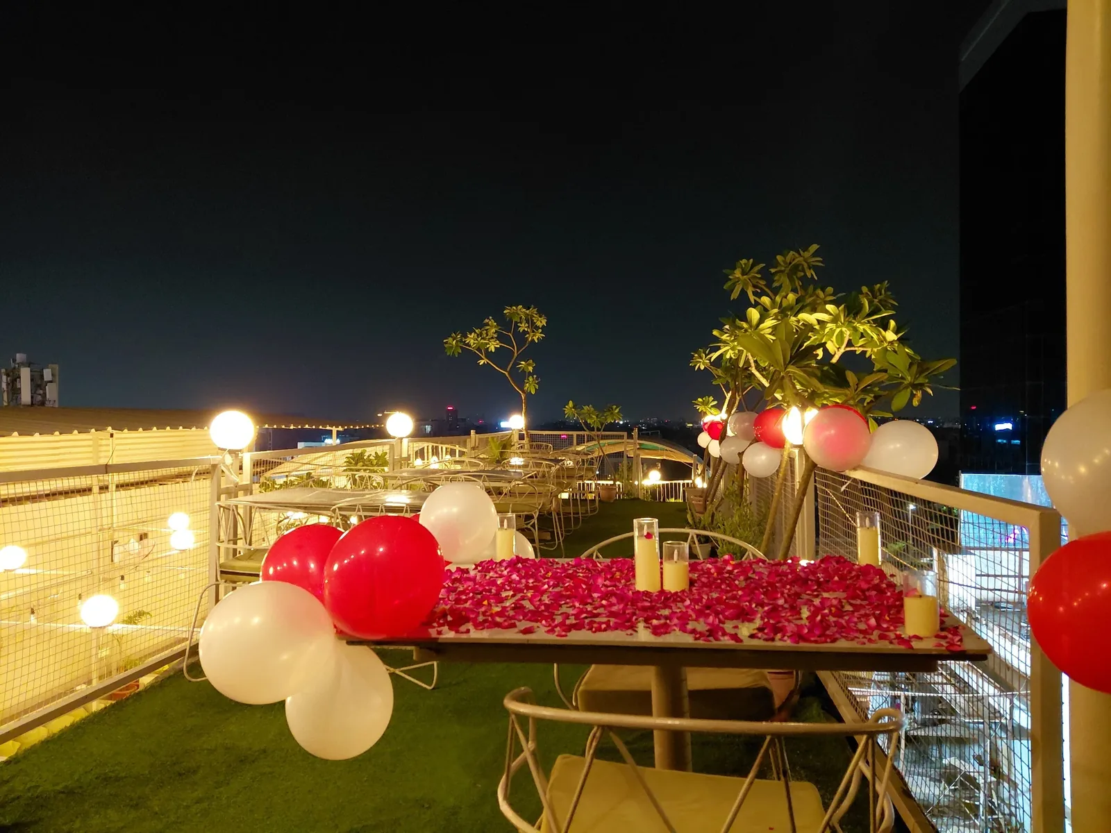 Real rooftop candle light dinner decoration at Chairish Cafe near WTP Jaipur