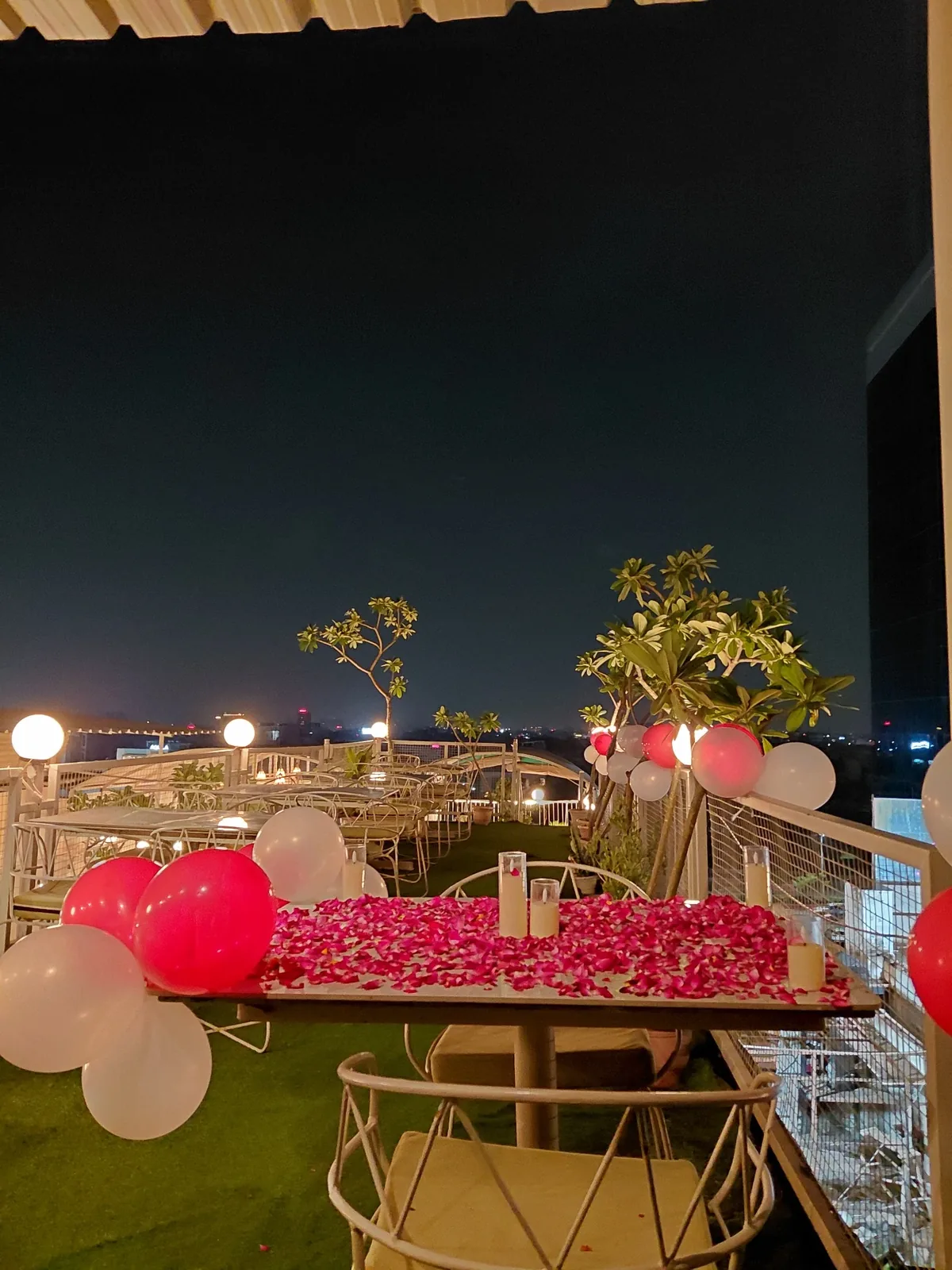 Couple decoration with petals and balloons at Chairish Cafe Jaipur