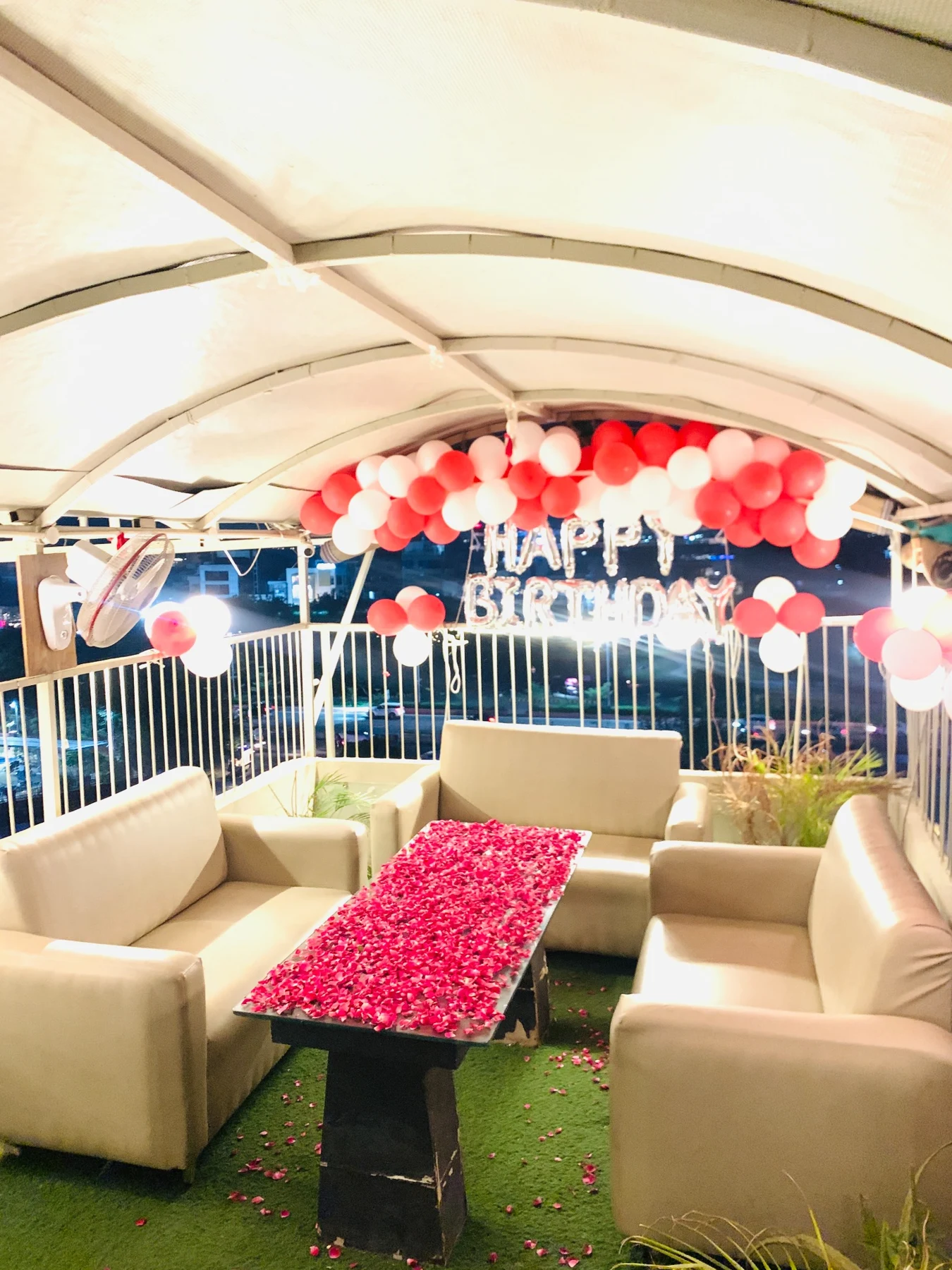 Original Chairish Cafe rooftop sofa seating birthday setup