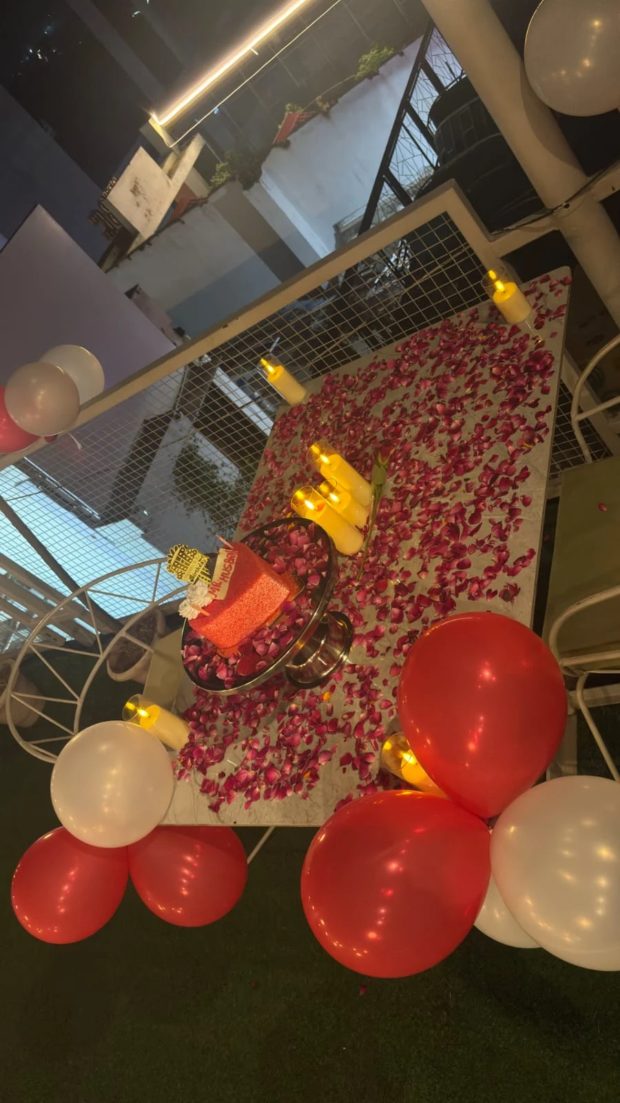 Chairish Cafe rooftop celebration table with cake and additional decoration