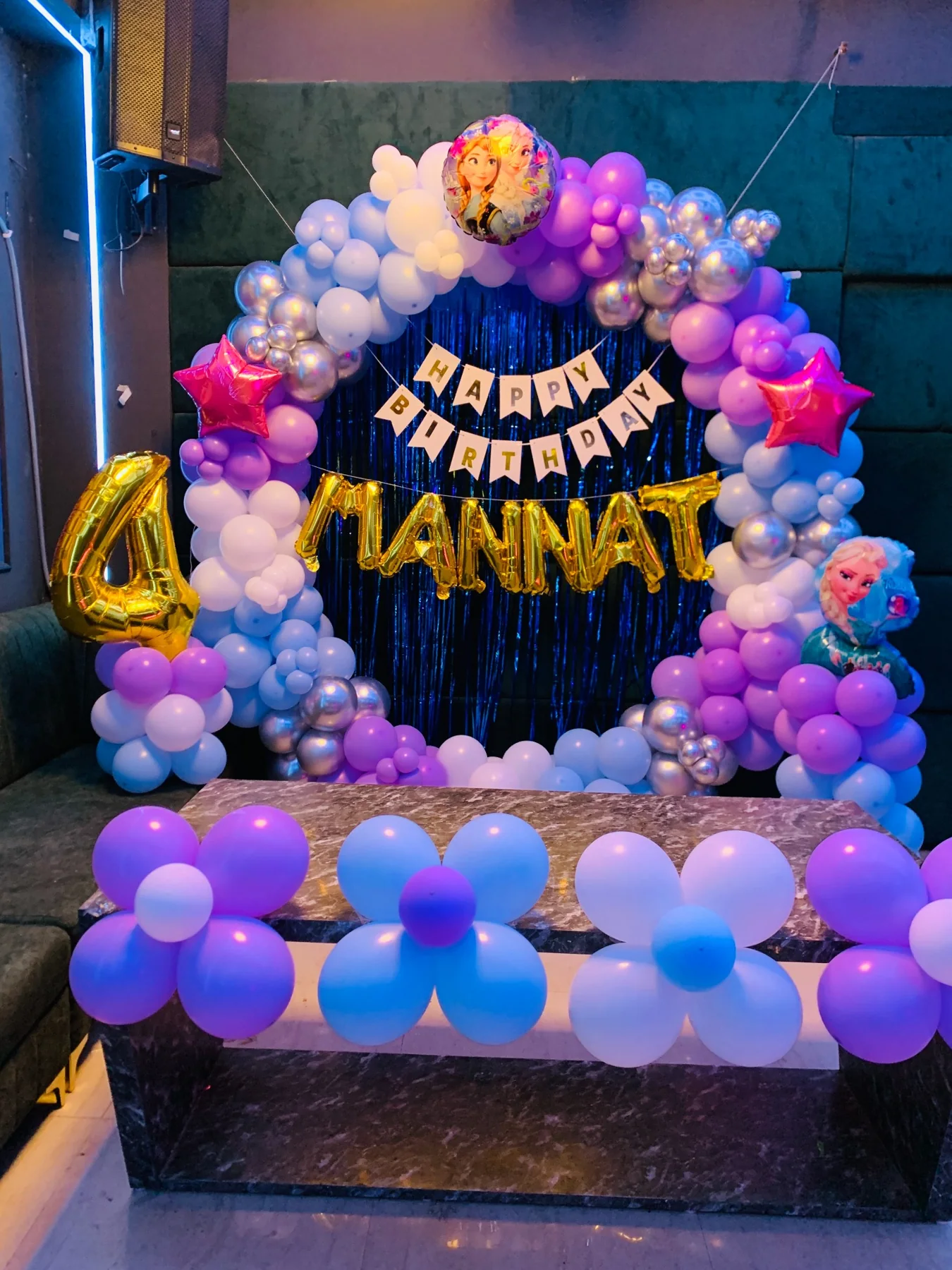 Real purple and blue themed kids birthday decoration at Chairish Cafe party hall near WTP Jaipur