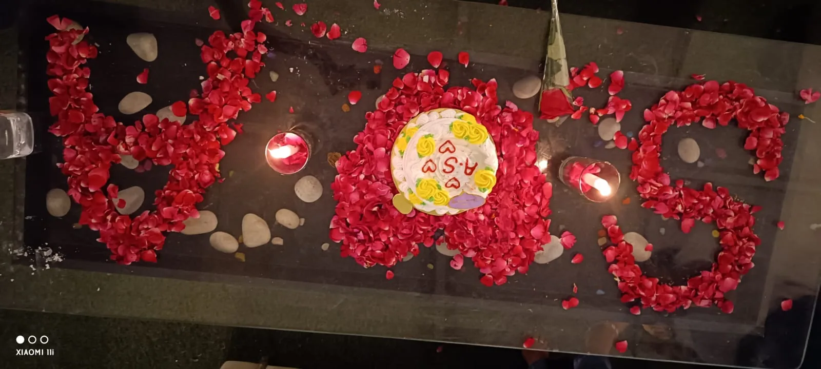 Love and cake table setup for couples at Chairish Cafe Jaipur